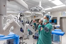 Robotics surgery with nurse setting up machine