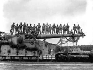 The Schwerer Gustav railroad gun after it was captured. Mahlon is the seventh man from the left.
