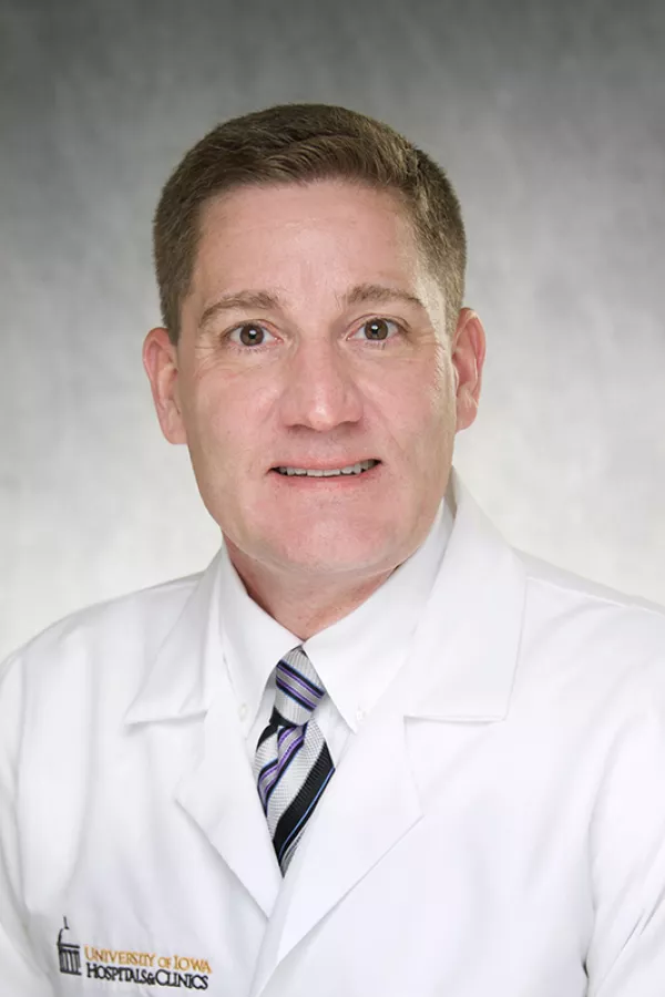 Daniel Fick, MD in white coat