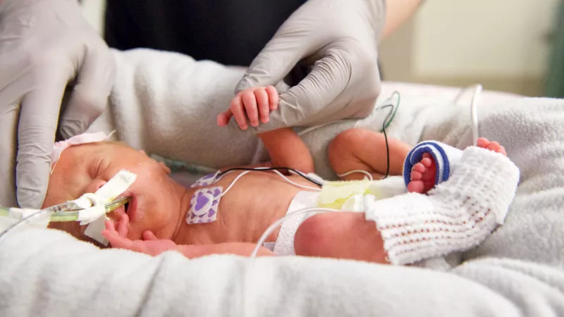 NIC nurse with neonate