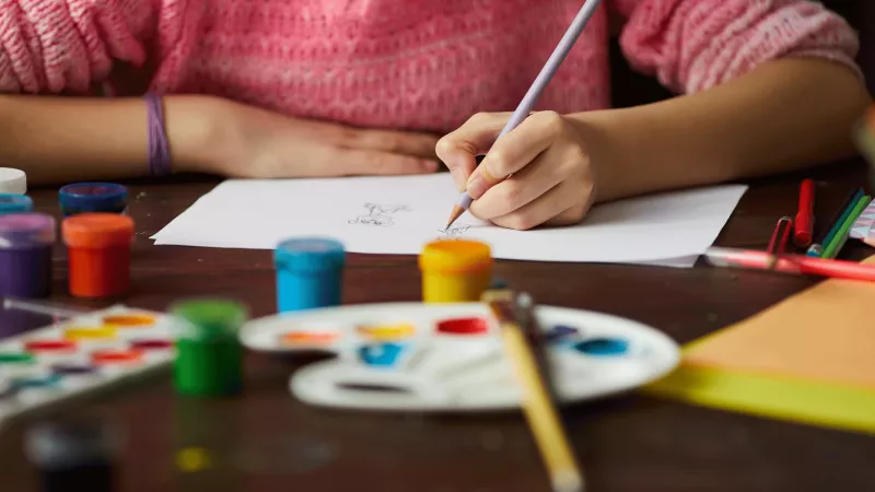Stock image of a child painting