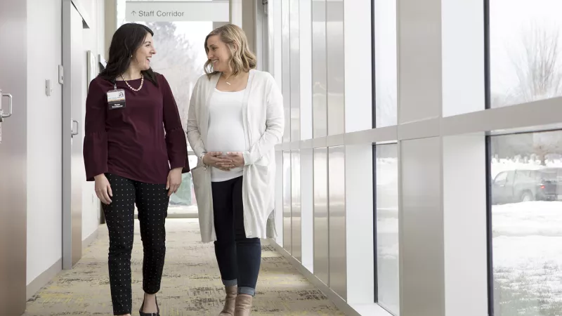 Provider and patient walk through the North Dodge clinic in 2019