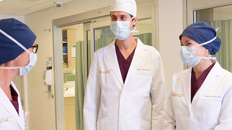 UI Health Care urogynecologists talking in a hallway