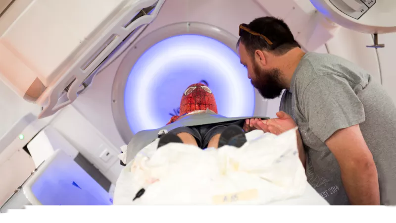 Hero photo of a pediatric patient undergoing a scan for a solid tumor
