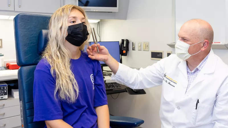 Marlan Hansen with simulated patient in the Otolaryngology clinic on Tuesday, Sept. 20, 2022.
