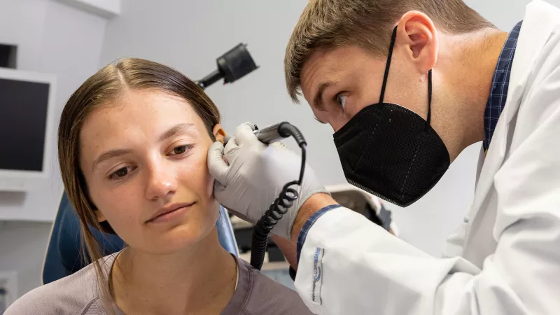 Matthew Hoffman with simulated patient in the Otolaryngology clinic on Wednesday, Oct. 5, 2022.