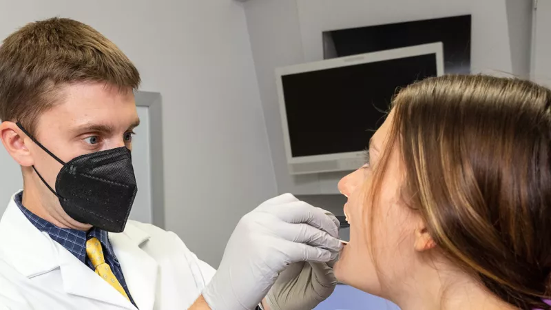 Matthew Hoffman with simulated patient in the Otolaryngology clinic on Wednesday, Oct. 5, 2022.
