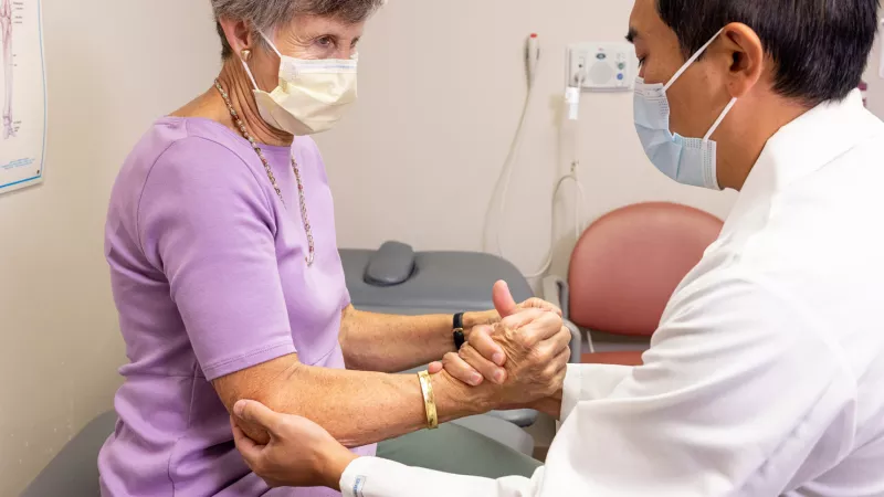 Dr. Philip Chen with simulated wrist patient on Wednesday, Aug. 24, 2022.