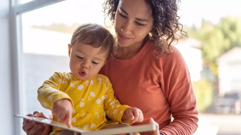 Mom reading to baby