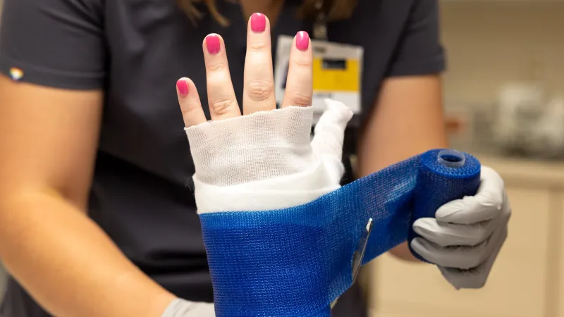 Nurse Hannah Riley puts a cast on a simulated patient in the Orthopedic Clinic on Monday, Aug. 22, 2022.
