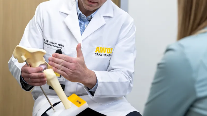 Dallas Vanorny, MD PhD, with simulated patient in the orthopedics clinic at UI Health Care Medical Center North Liberty on Monday, Feb. 24, 2025. 