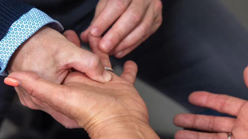 Joseph Buckwalter V, MD PhD, with simulated hand and wrist patient in the orthopedics clinic at UI Health Care Medical Center North Liberty on Tuesday, April 29, 2025. Patient consent on file. 