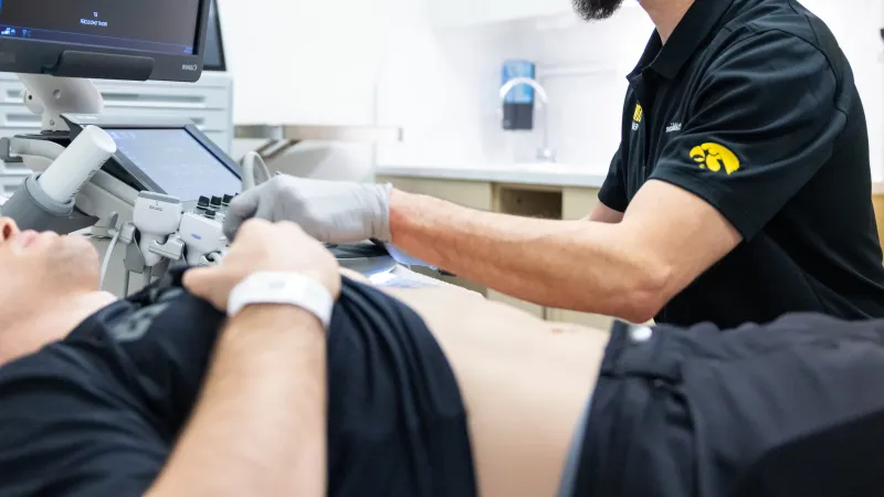 Mederic Hall, MD, uses ultrasound with patient in the sports medicine clinic at UI Health Care Medical Center North Liberty on Tuesday, April 29, 2025. Patient consent on file, and patient information has been blurred or removed. 