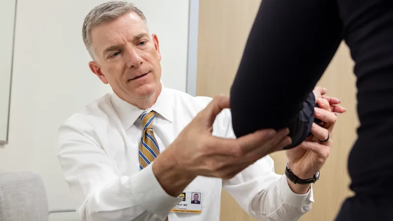 Brian Wolf, MD, with simulated patient in the Sports Medicine clinic at UI Health Care Medical Center North Liberty on Tuesday, April 29, 2025. 