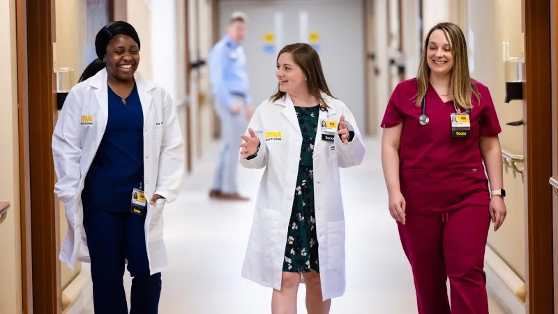Family Medicine residents Ofure Omokhodion, MBChB, and Sarah Costello, MD, with medical director Jessica Rockafellow, MD, in the Family Medicine inpatient unit 3 Center at UI Health Care Medical Center Downtown on Wednesday, July 9, 2025. 