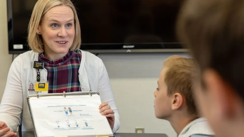 Genetic counselor Amanda Odell, MS, LGC, in the Otolaryngology clinic at UI Health Care university campus with simulated patients on Wednesday, Oct. 9, 2024.