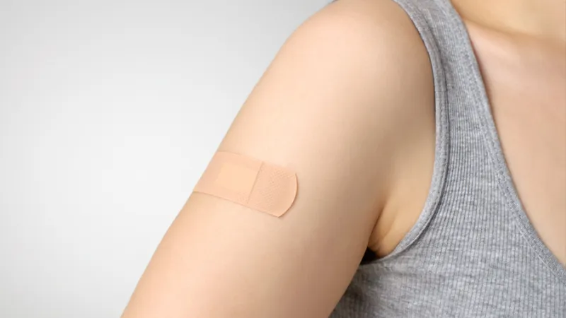 woman with band-aid on arm