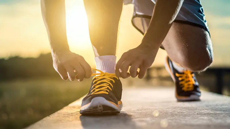 Man lacing his sneakers