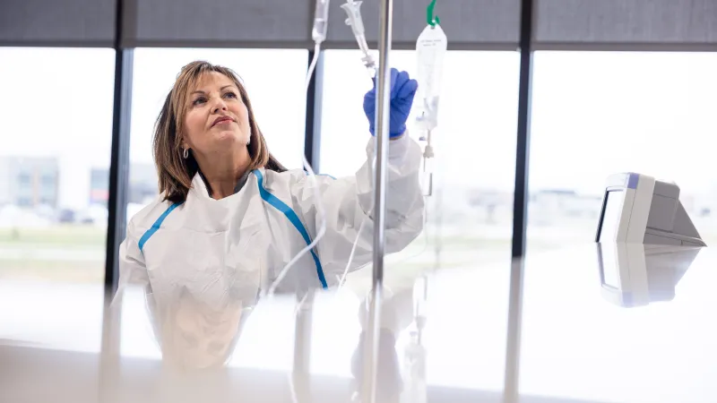 Amy McGargill, RN, BSN, with a patient at Mission Cancer + Blood - Waukee, part of UI Health Care, on Thursday, April 2, 2026. Patient consent on file; image may be altered to remove private information.
