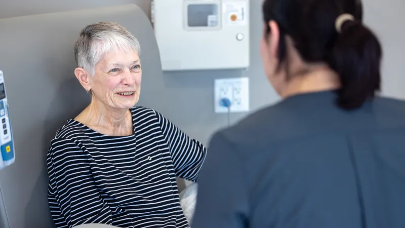 MacKenzie VanDenBerg, RN BSN, with a patient at Mission Cancer + Blood - Waukee, part of UI Health Care, on Thursday, April 2, 2026. Patient consent on file; image may be altered to remove private information.