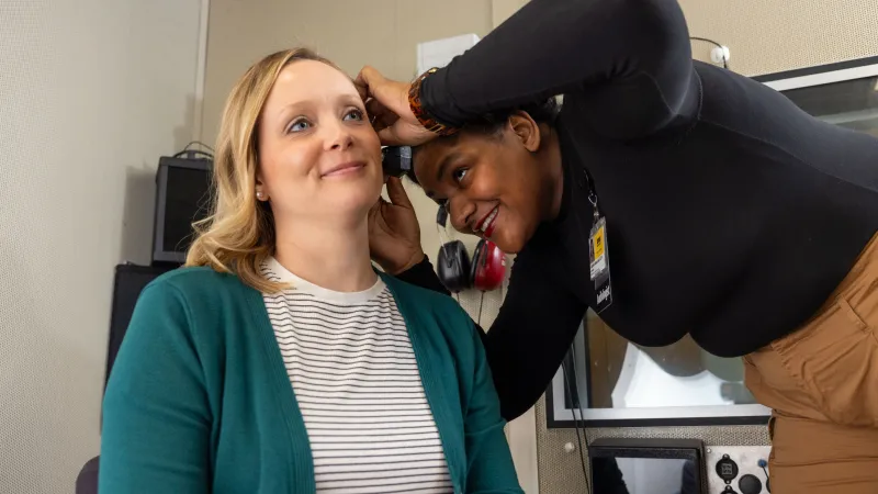 audiologist with patient