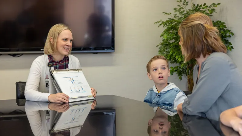 Provider doing genetic counseling with family
