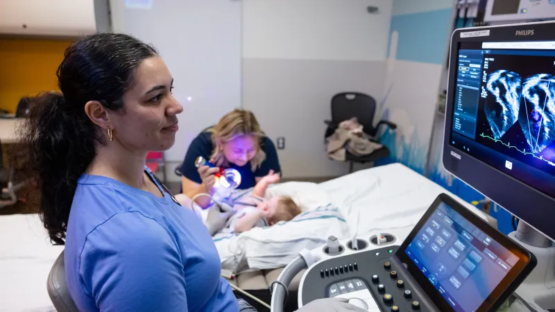 Provider performing cardiac imaging