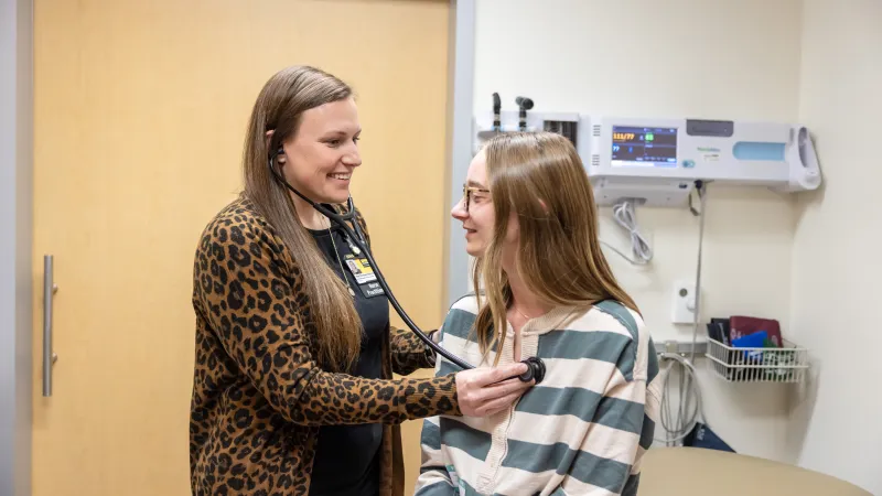 Hope Breitbach, ARNP, SANE-A, SANE-P, with a pediatric patient 