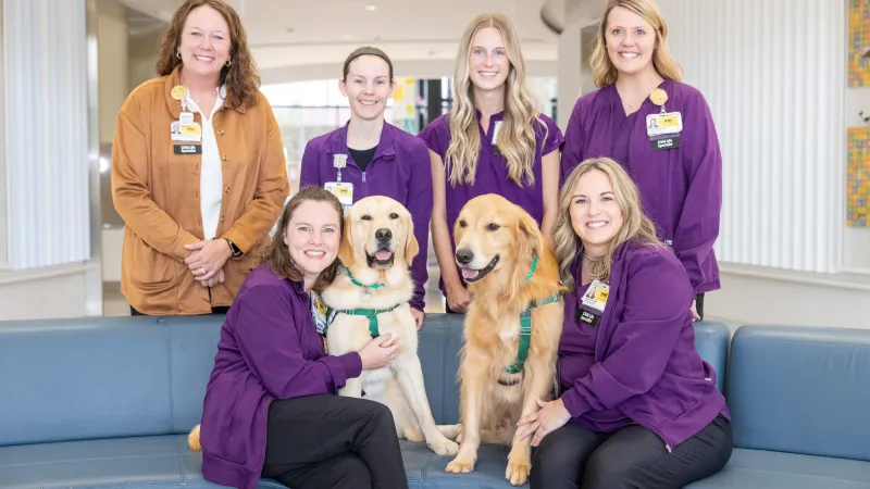 Facility dogs Caitlyn Clark and Nacho at Stead Family Children’s Hospital on Thursday, Sept. 24, 2026.