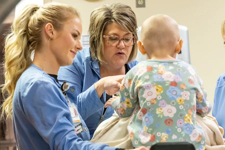 Imagine Technicians working with a child patient