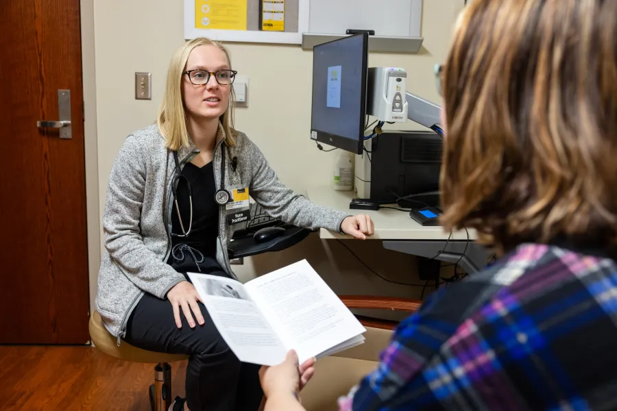HCCC nurse practitioner meets with patient