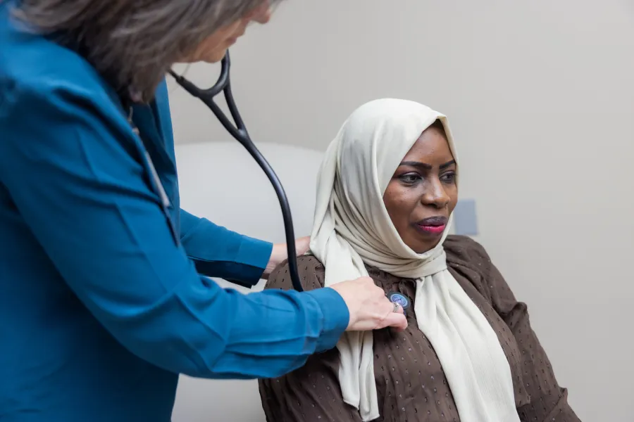 Family medicine physician Jill Endres, MD, with patient at UI Health Care Family Medicine practice.