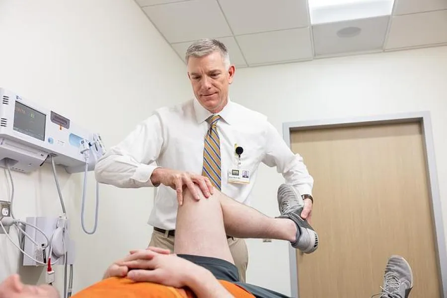 Brian Wolf, MD, with simulated patient in the Sports Medicine clinic at UI Health Care Medical Center North Liberty on Tuesday, April 29, 2025. 