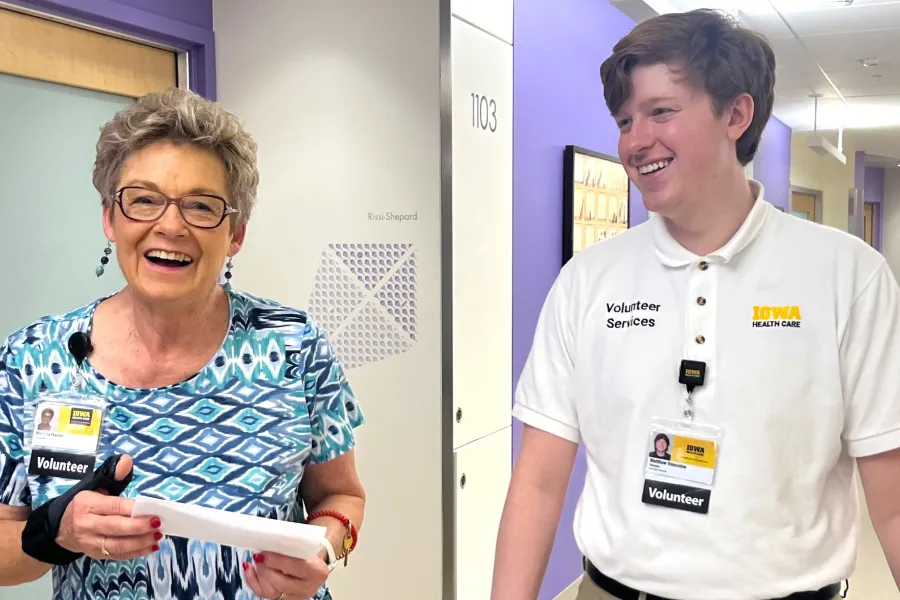 Two volunteers laughing