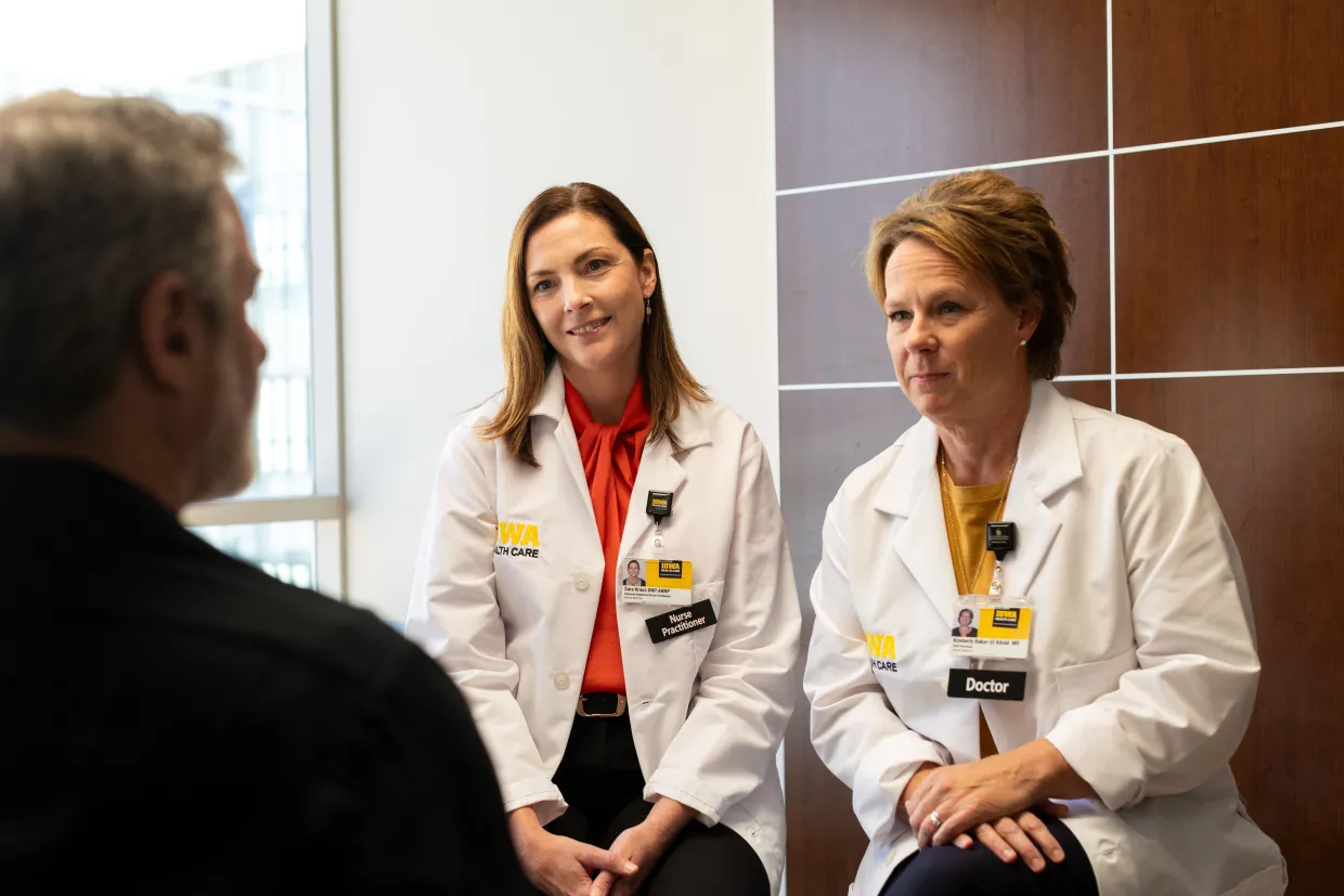 Providers talking to a lung cancer patient