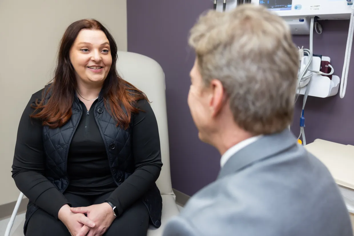 Family medicine physician Jason Wilbur, MD, with patient at UI Health Care Family Medicine.