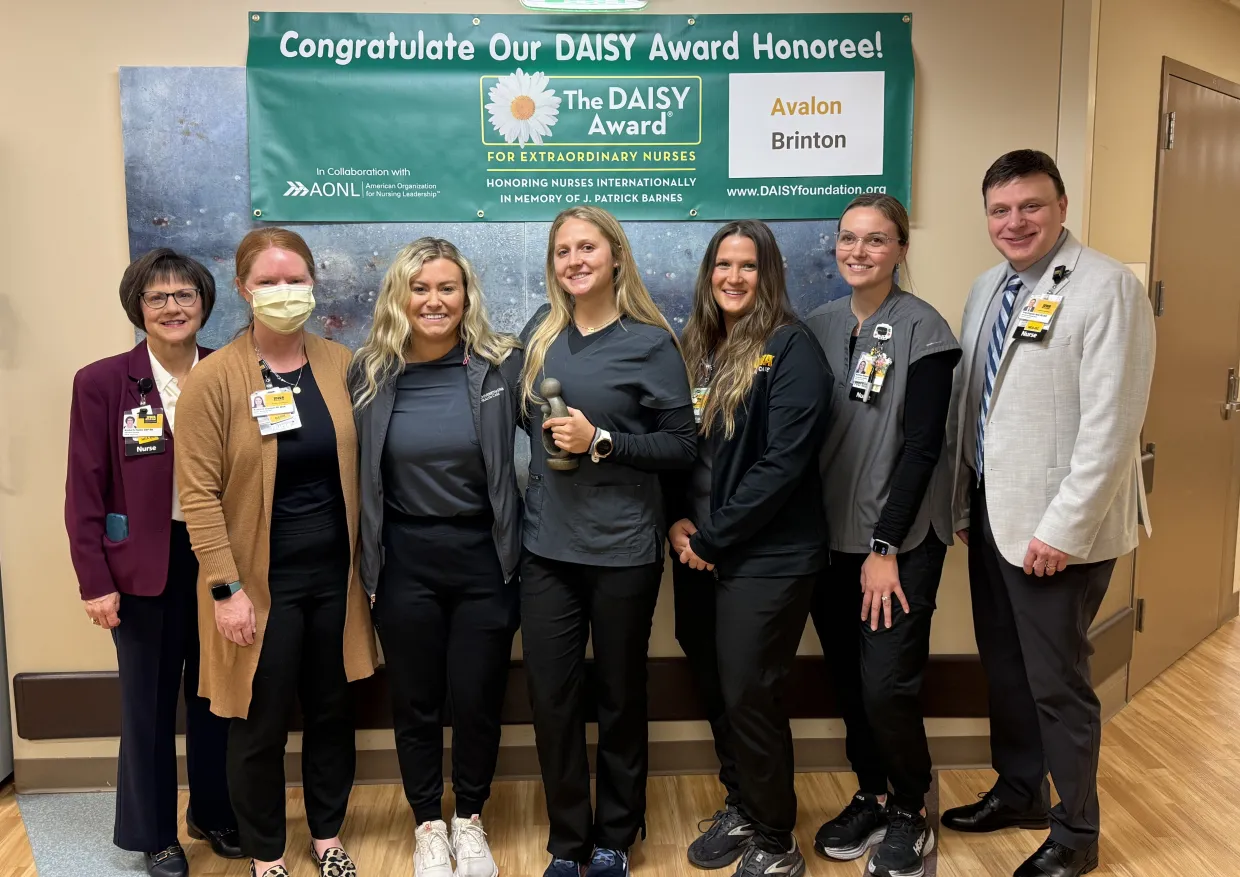 Avalon Brinton receives a daisy award.