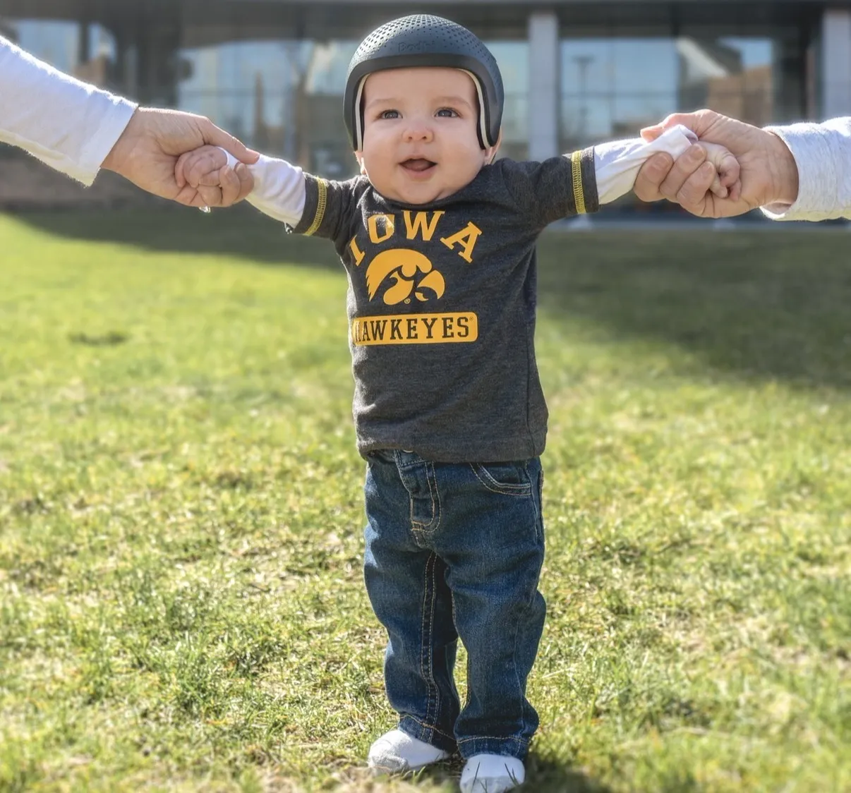 Bodhi walks with his parents.