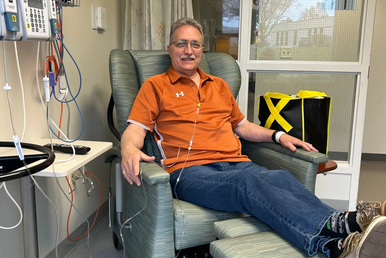Jeff Yets sitting in a hospital chair.