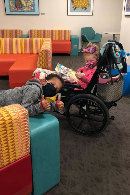 Eli Belser in waiting room with a new friend