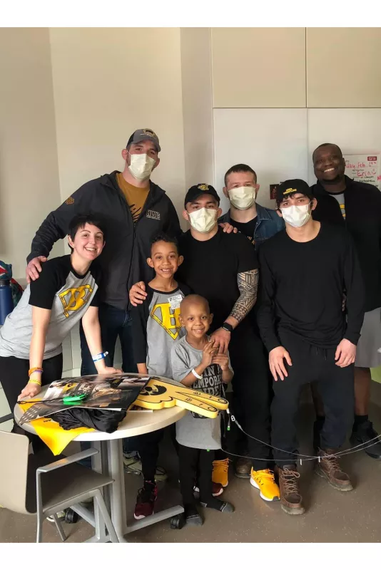 Iowa wrestling team visits Eli in the hospital