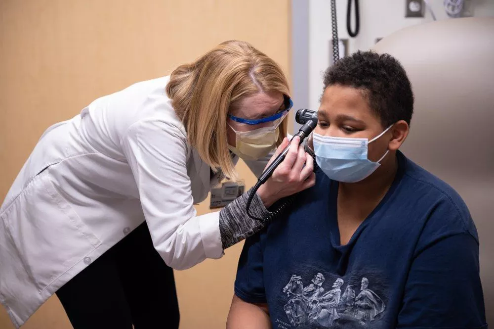 Kidney transplant provider examining a patient