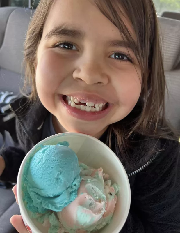 Eve Jimenez holding ice cream and smiling