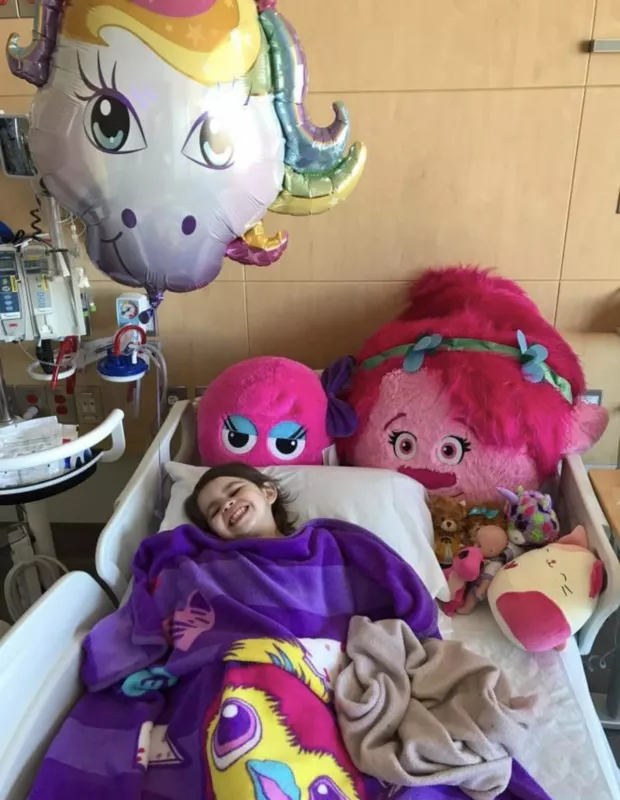 Eve Jimenez laying in hospital bed