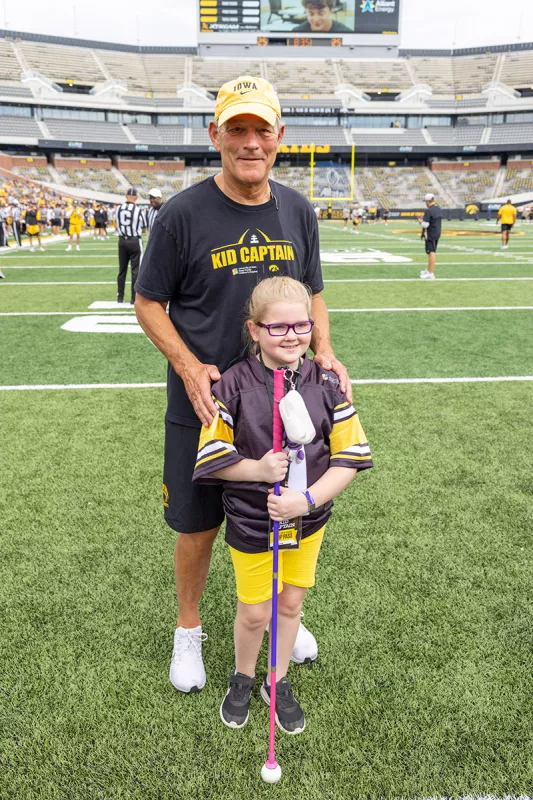 Elyna Clements with Kirk Ferentz on Kids Day 2022