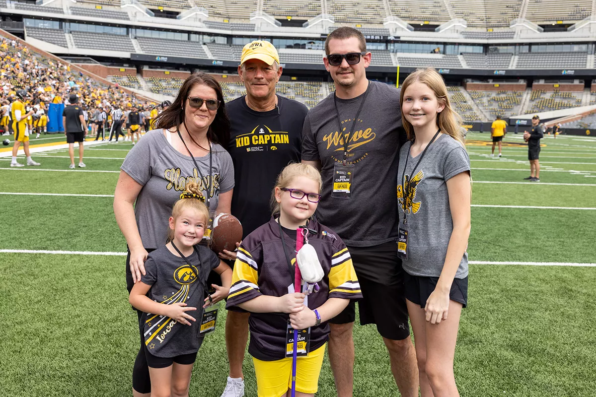 Kirk Ferentz with Clements family on Kids Day 2022