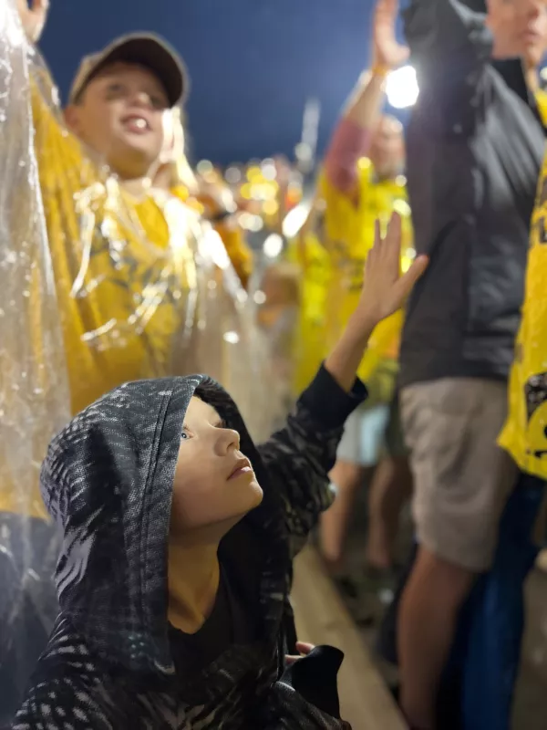 Carver Meiner attending a University of Iowa football game