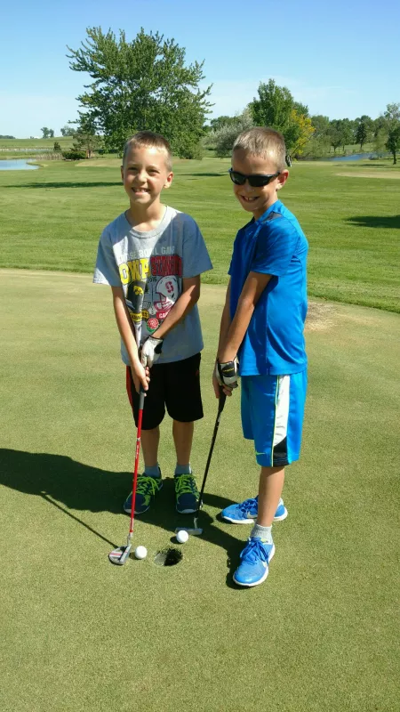 Gavin Miller and twin playing golf