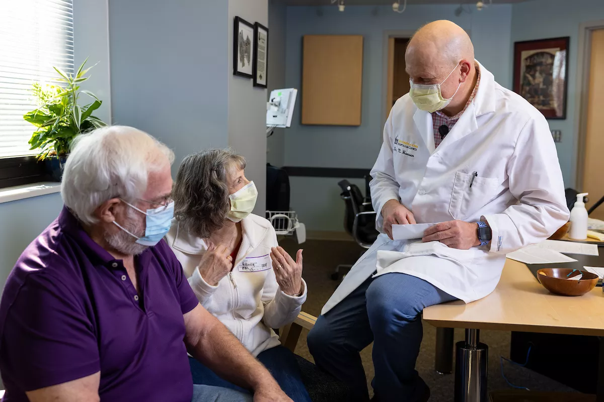 Dr. Marlan Hansen talks with patients Roberta and James Carver in the Audiology clinic on Tuesday, Nov. 9, 2021. Patient consent form on file.