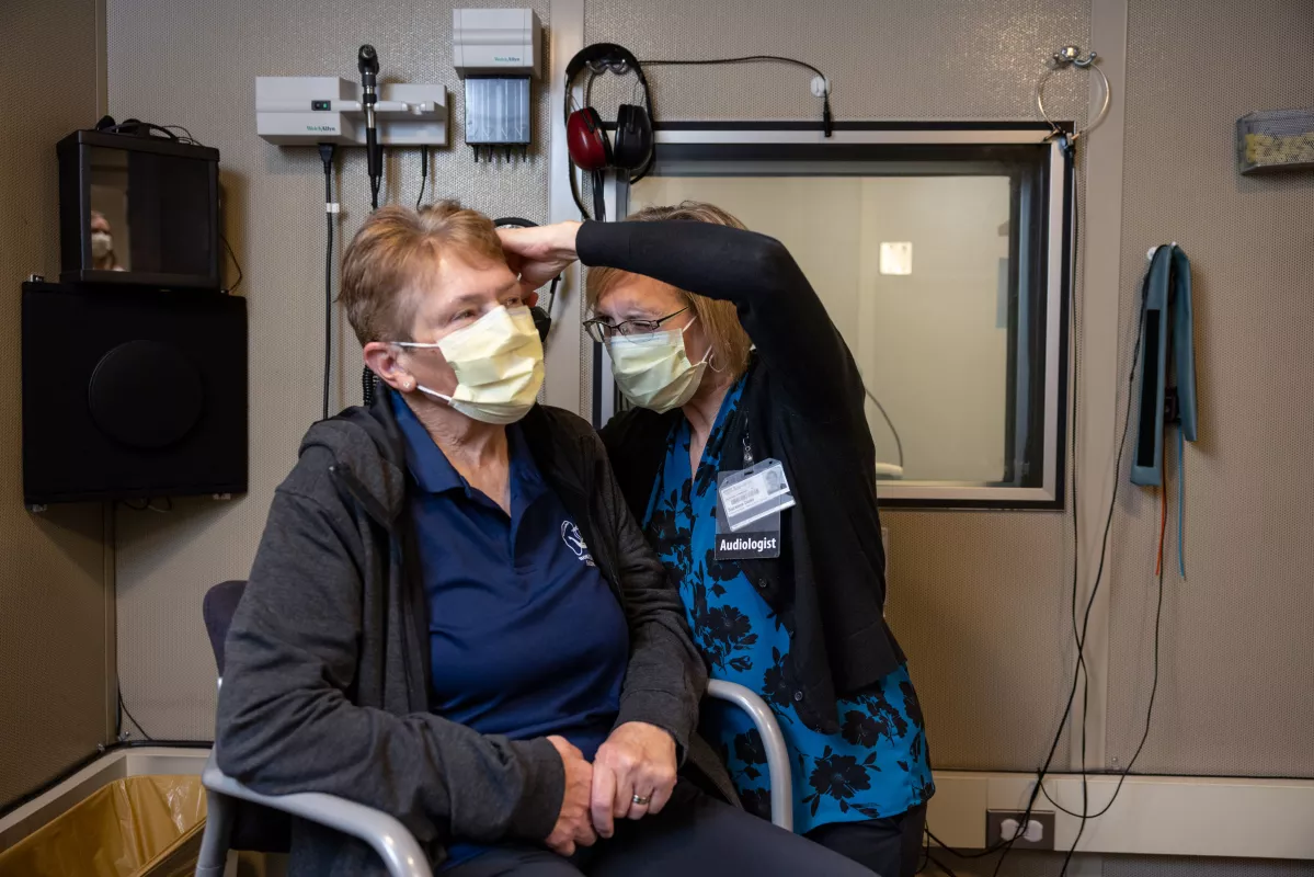 Audiologist Suzanne Dunn with a simulated patient in the Otolaryngology Clinic Thursday, Oct. 20, 2022.